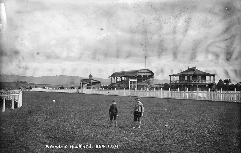 Two children standing on the racetrack of the Avondale Jockey Club in Auckland