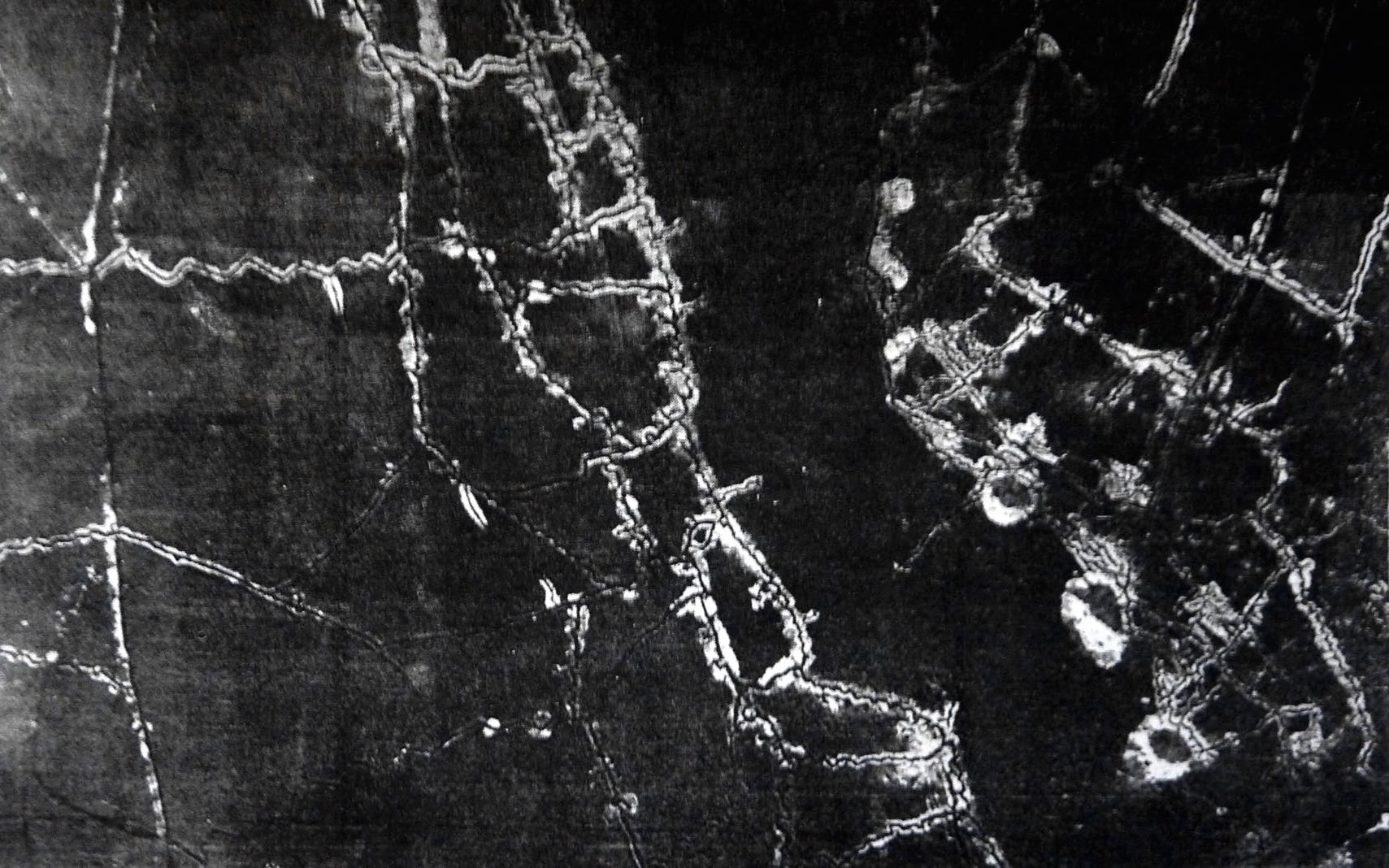 Three craters formed by underground explosions made by the German miners close to the British trenches